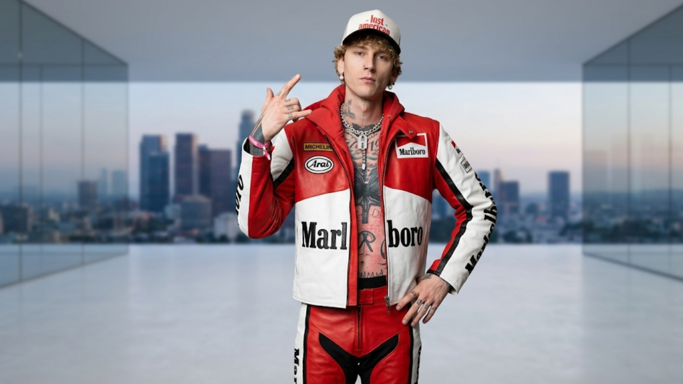 Machine Gun Kelly Las Vegas F1 Grand Prix 2026 red white leather racing jacket Marlboro Michelin patches motorsport streetwear