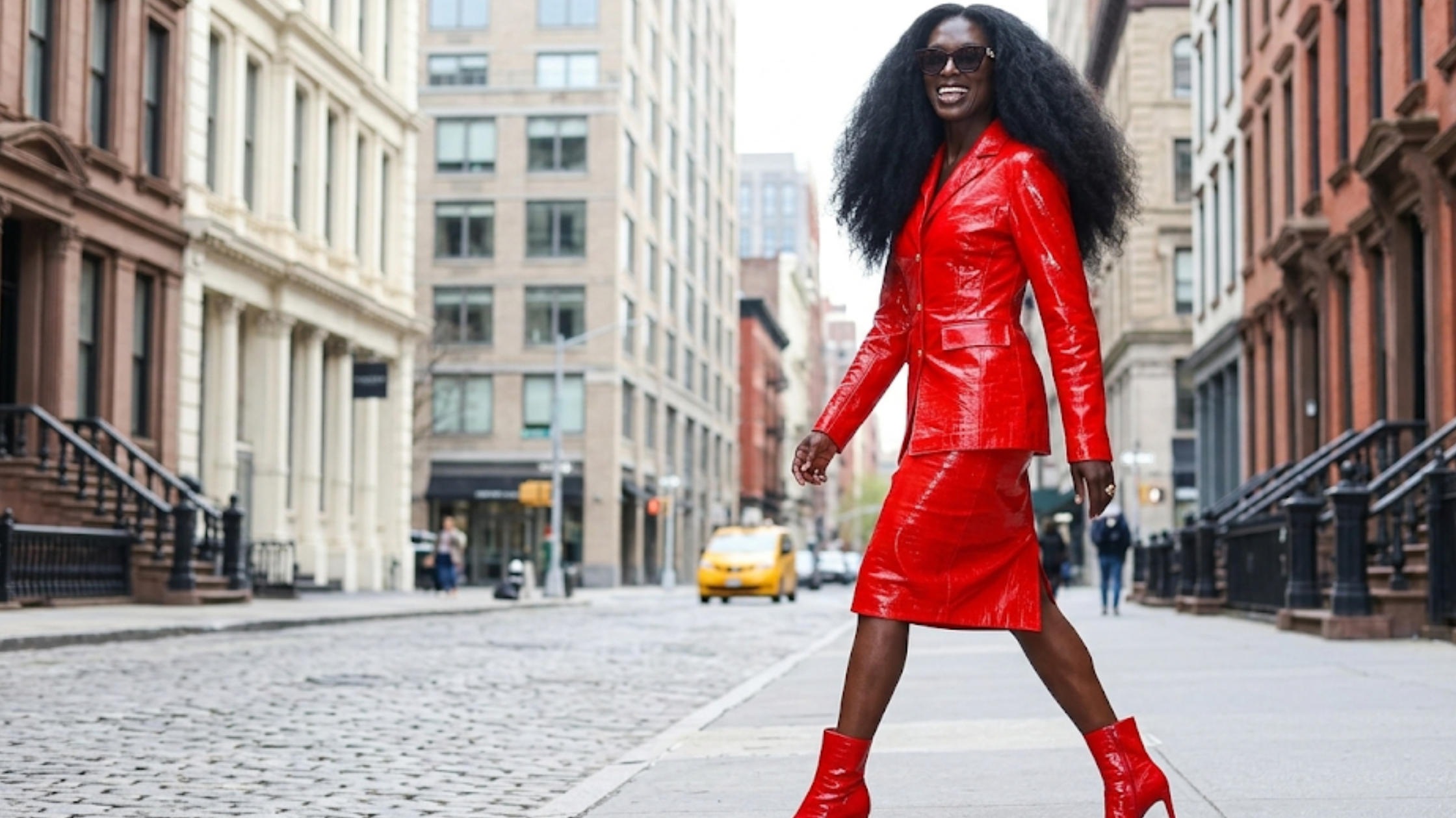 Jodie Turner-Smith Live with Kelly and Mark NYC 2026 red patent leather blazer skirt set gold buttons croc embossed glossy jacket Hudson Square fashion