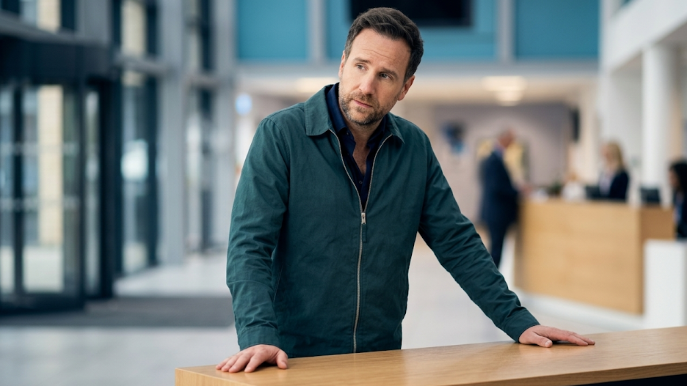 Rafe Spall Trying S04 slate blue Harrington-style cotton jacket with silver zipper, shirt collar, and minimalist smart casual design